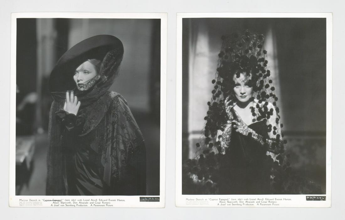 Marlene Dietrich Photographed by J.J. McCarthy: Two Marlene Dietrich photographed by J.J. McCarthy vintage publicity still photos. Both are with glossy surface, black and white photographs measuring approximately 8 in. x 10 in. Both are on double-w