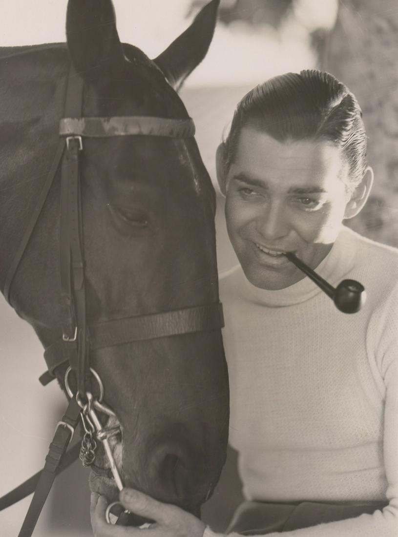 Clark Gable Photographed by C.S. Bull: Clark Gable vintage oversized publicity photo. Photographed by Clarence Sinclair Bull with photographers rubber stamp verso and blind stamp lower right. Glossy surface, double-weight black and white p