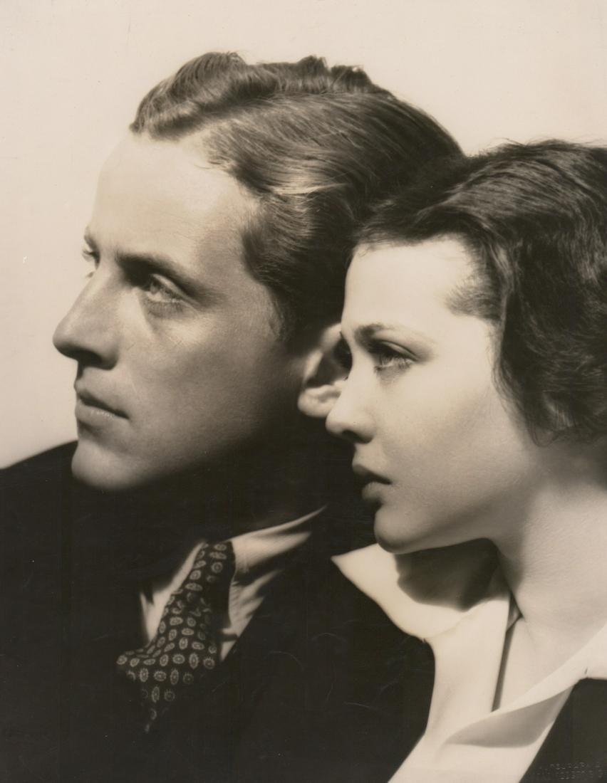 Phillips Holmes, Sylvia Sidney by Richee Oversized: Phillips Holmes and Sylvia Sidney vintage oversized publicity photo. Photographed by Eugene Robert Richee with photographers rubber stamp verso and blind stamp lower right.. Glossy surface, double-wei
