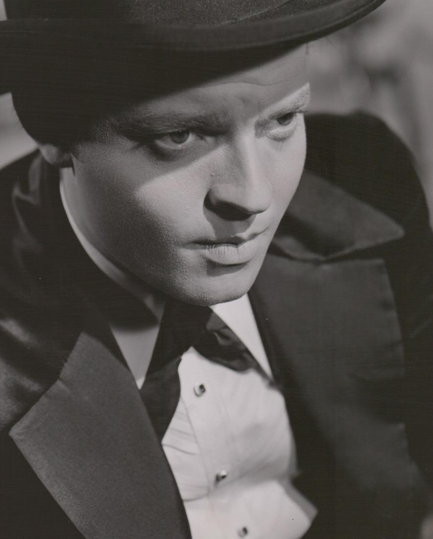 Orson Welles Photographed by Alexander Kahle: Orson Welles in 'Citizen Kane' photographed by Alexander P. Kahle (1941 Academy Exhibit). Glossy surface, double-weight black and white gelatin silver print measuring 7.875 in. x 9.75 in. VG-EX/EX con