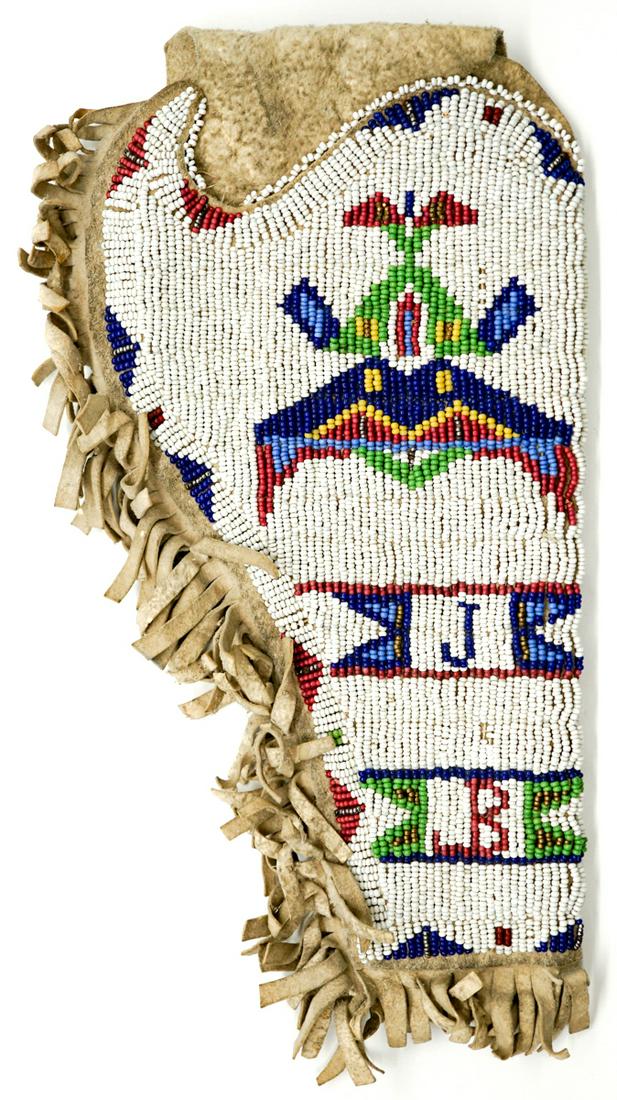 Sioux Beaded Holster Circa 1920: Old Sioux Native American Sioux beaded holster circa 1920 with the initials 'JB'. Measures 10.25 in. x 5.5 in. Very good condition. If lot is absent of a condition report a condition report may be req