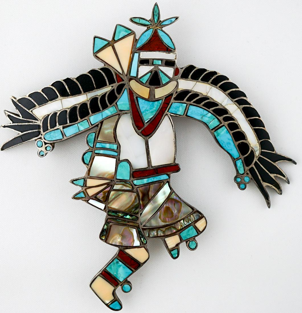 John Martin Large Zuni Pendant: John Martin signed large Zuni pendant. Measures 3.9375 in. x 3.75 in. Excellent condition. Provenance: Washington state private collection. If lot is absent of a condition report a condition report ma
