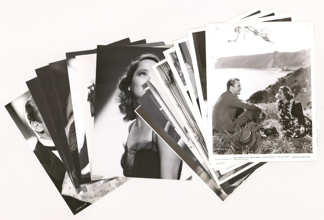 Merle Oberon Vintage Photos (16): Merle Oberon vintage publicity and production photos. Includes production photos of 'Beloved Enemy' (Samuel Goldwyn, 1936); and more. Black and white single-weight, glossy surface photographs measure 