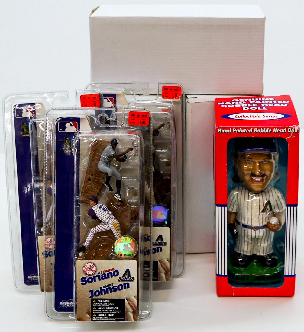 Randy Johnson AZ Diamondbacks Collectibles (7): A group seven of Randy Johnson Arizona Diamondbacks collectibles. Includes (3) Noon's bobbleheads (MIB) and three McFarlane figures with Soriano (MIP). If lot is absent of a condition report a conditi