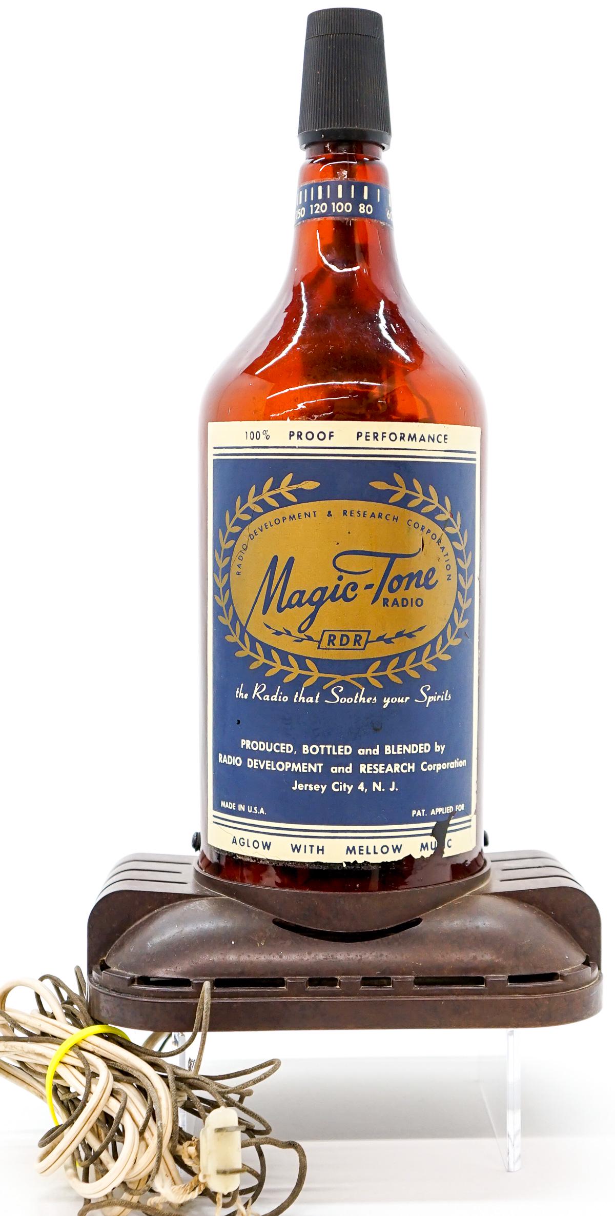Magic-Tone Radio: Magic-Tone bottle radio. In working order, measures 14.75 inches tall. No damage, would benefit from a proper cleaning. If lot is absent of a condition report a condition report may be requested via e