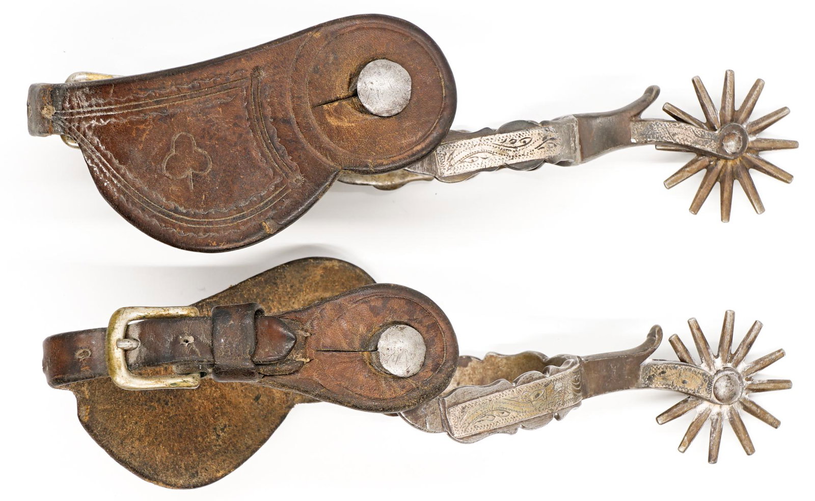 A Pair Of Antique Spurs: A pair of antique spurs. They measure 6 inches x 3 inches (not measuring the leather). If lot is absent of a condition report a condition report may be requested via email. Condition report is provide