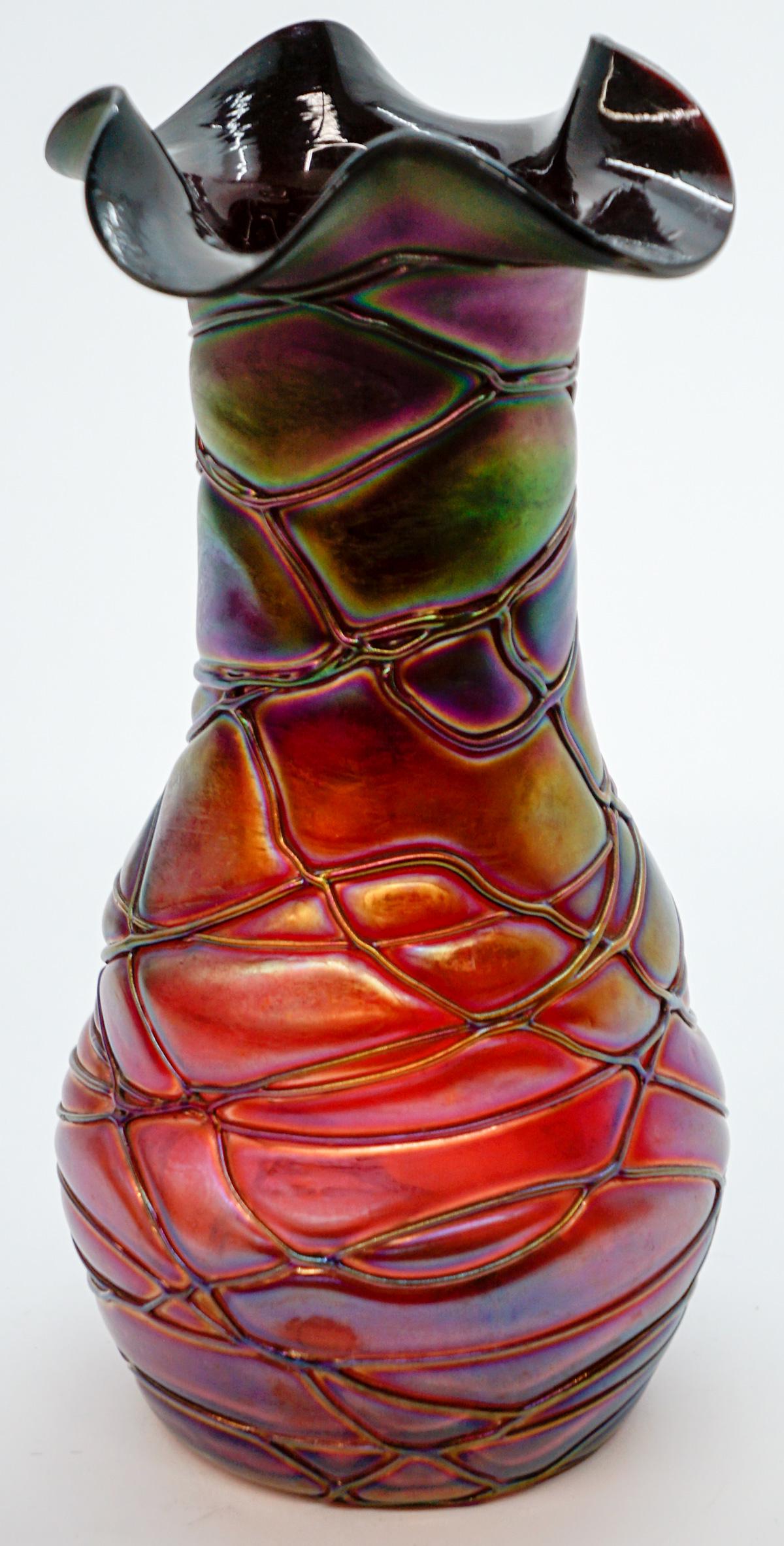 Pallme Konig Iridescent Vase: Pallme Konig (PK) iridescent vase. Measures 9 inches tall. Excellent condition with no chips, cracks, repairs or damage. If lot is absent of a condition report a condition report may be requested via 
