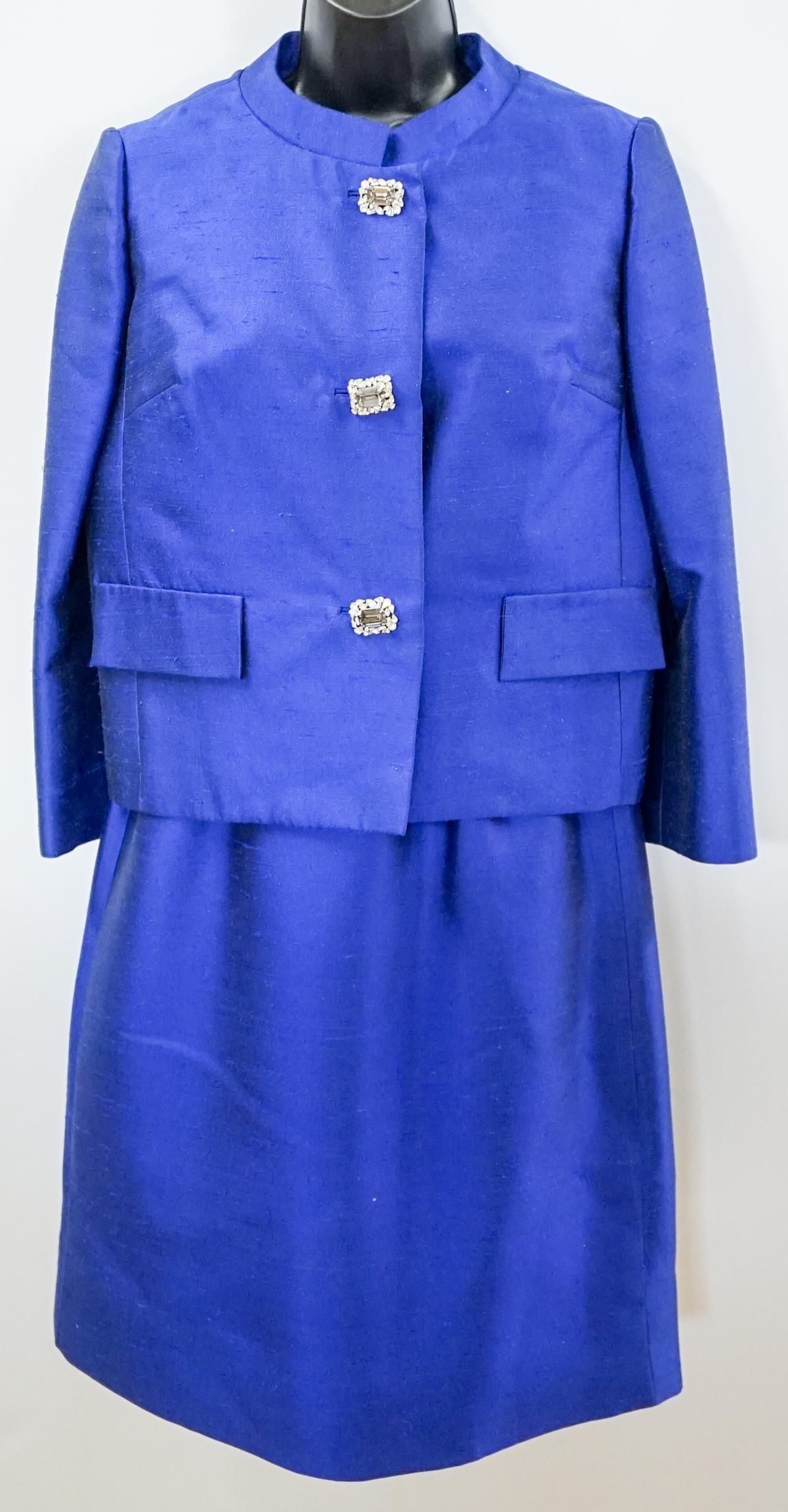 Lilli Ann and Gene's Butte MT Dress and Jacket: Lilli Ann relabeled Gene's Butte MT Vintage 2 Piece Blue Shantung lined Dress set. Dress with jewel button at waist measures 34 in. bust, 28 in. waist 40 in. hip 33 in. length. Jacket with 3 jewel but