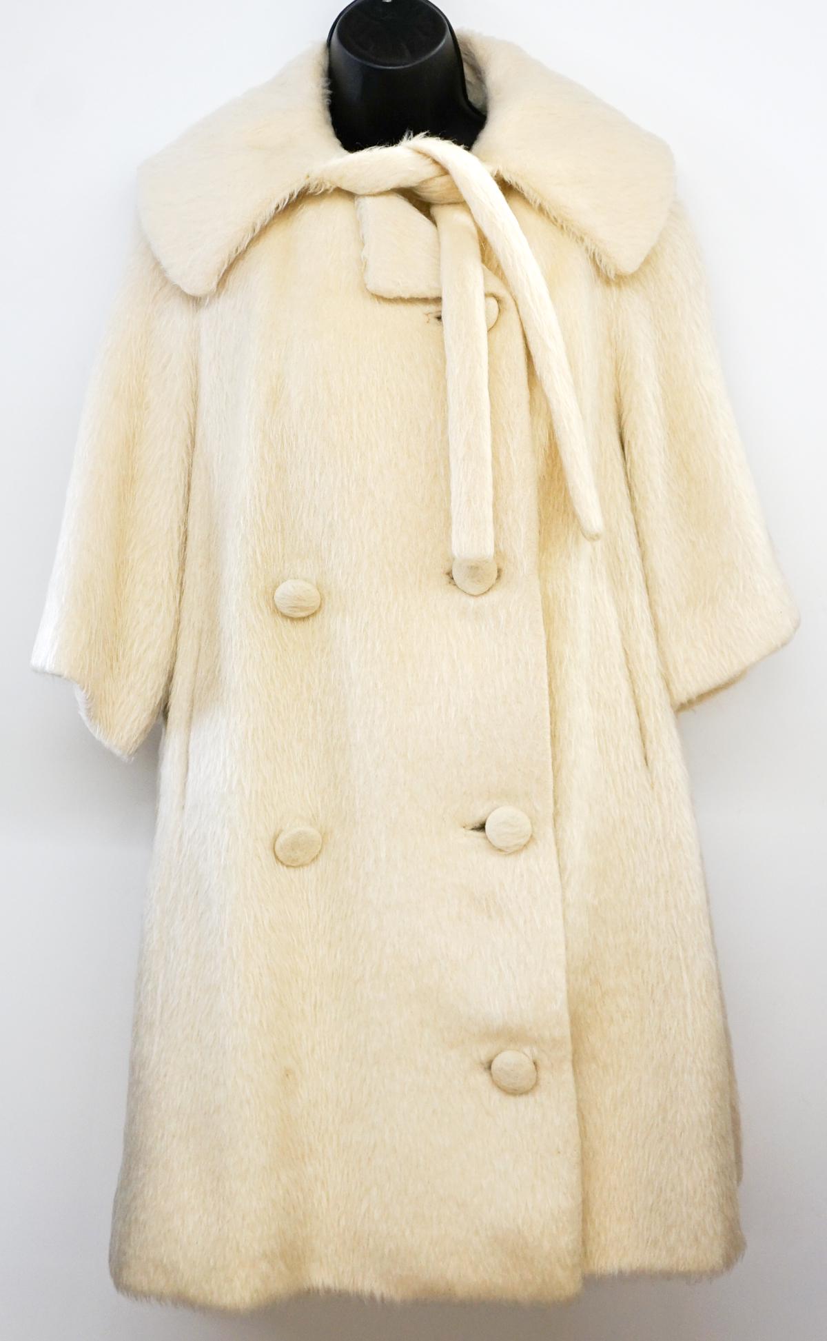Lilli Ann Paris Cream Knit Coat: Lilli Ann Paris Vintage Double breast 4 button Cream Knit Coat fully lined. Measures 16 in. across shoulders, 40 in. bust 36 in. length, 15 in. 3/4 length sleeve. Some yellowing through out. Excellent