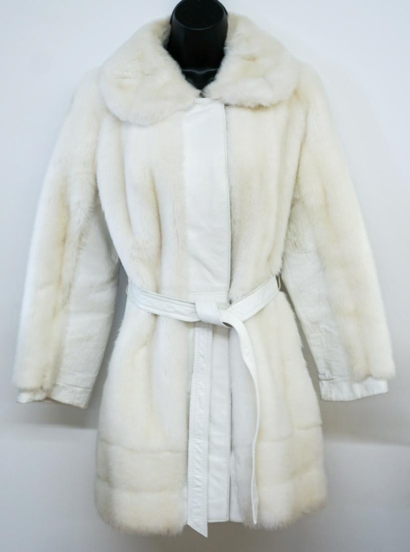 Lilli Ann San Francisco Leather and Fur Coat: Lilli Ann San Francisco Vintage Belted Cream Leather and Fur, fully lined coat measures 16in. across shoulders, 36 in. bust, 31.50 in. length, 22 in. sleeve. Shows some ware at elbows and small staini