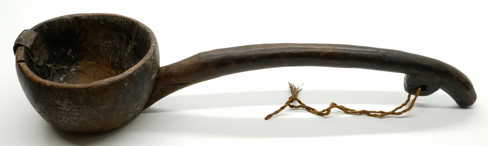 19th Century Pakistan Swat Valley Ladle: 19th century ladle from Swat Valley, Pakistan. Measures 21.25 in. x 6 in. If lot is absent of a condition report a condition report may be requested via email. Condition report is provided as an opini