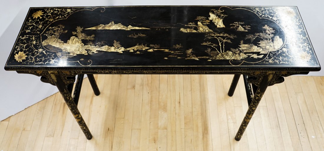 An Old Chinese Black Lacquer Table: An old Chinese black lacquer table. Measures 32 in. x 53 in. x 15 in. Good to very good condition. If lot is absent of a condition report a condition report may be requested via email. Condition repor