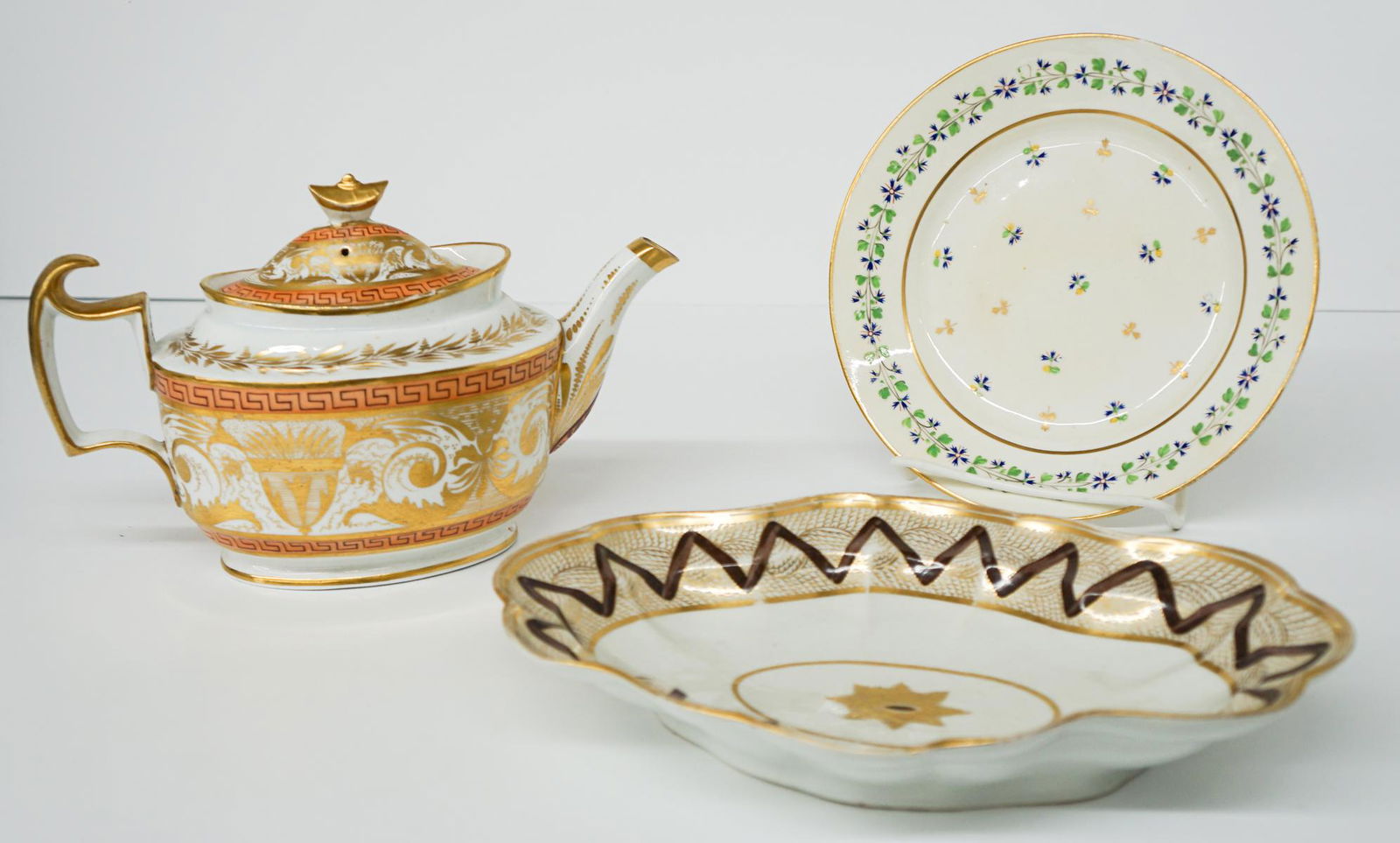 English Antique Porcelain (3): Antique English porcelain including a plate measuring 8.75 inches, ca.1810 teapot measuring 6.75 in. x 10.75 in. (small chip on base) and an early oval platter measuring 11.625 in. x 2 in. If lot is a