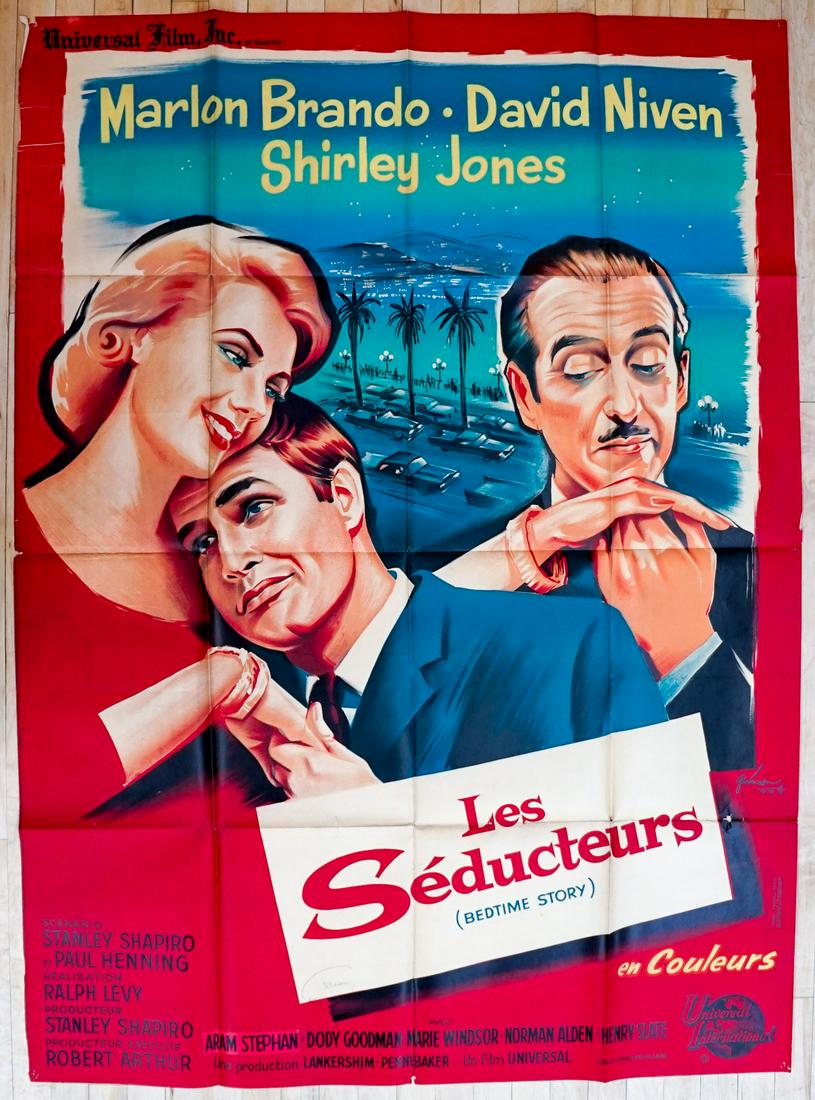 Marlon Brando Bedtime Story French Movie Poster: Marlon Brando, Shirley Jones and David Niven in Bedtime Story - Les Seducteurs (Universal Intl, undated) large French folded one panel grande movie poster. Measures 63 in. x 45.5 in. Has been stored f