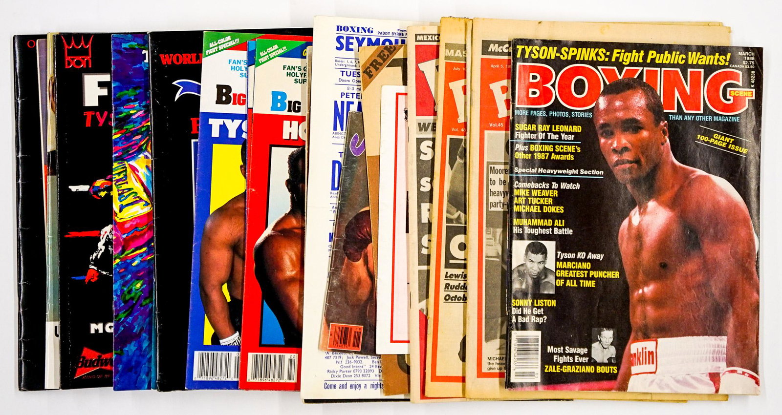 Boxing Programs and Magazines (19): A group of vintage boxing programs and magazines (19 pieces total). Buyer must view photographs or scans to assist in determining condition and ask further questions if so desired. We ship most items 