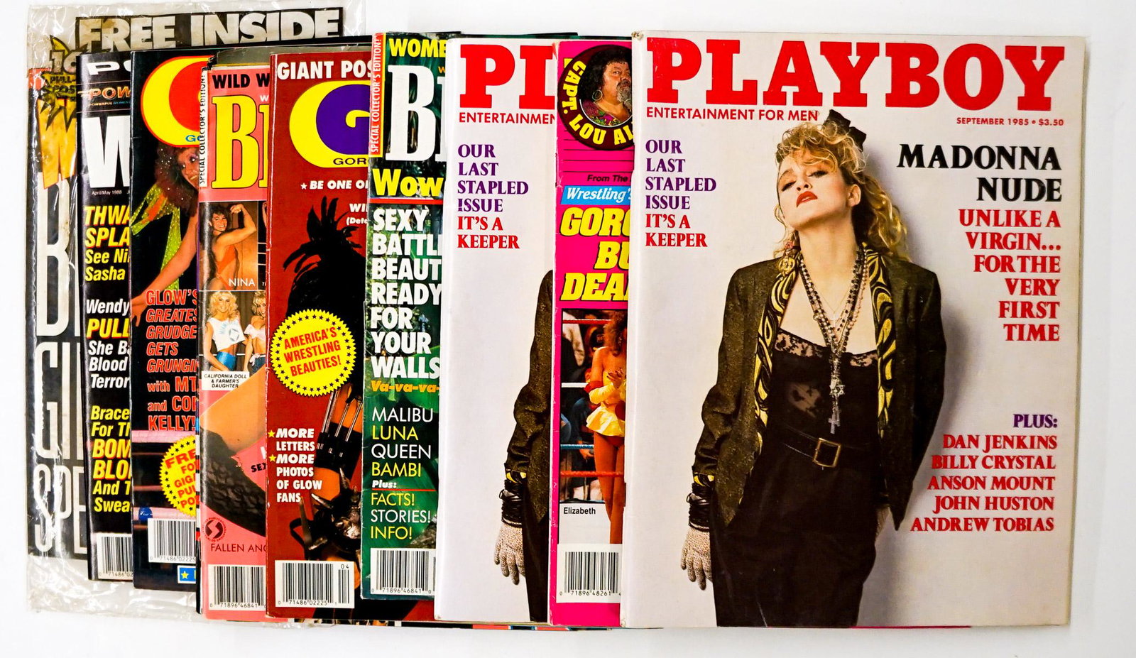 Female Wrestler Magazines Assorted ((10): Assorted Female Wrestling and Madonna Magazines group of (10). Various issue years. Provenance: Estate of James Baldwin Baker, Cornelius Oregon. If lot is absent of a condition report a condition repo