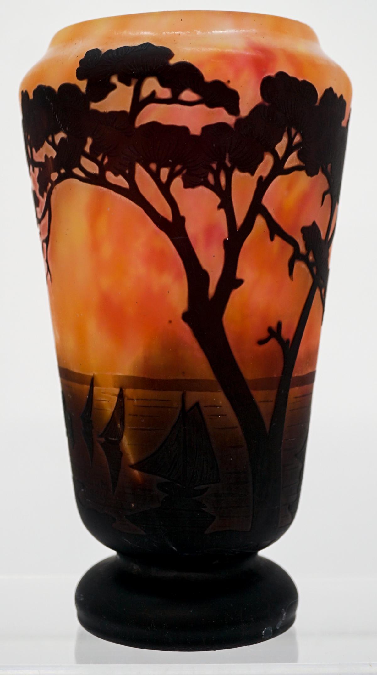 Daum Nancy Cameo Glass Vase with Sailboats: Daum Nancy cameo glass vase with sailboats, ca.1900. Mottled orange, ground with near black acid cutting. Measures 7.25-in. tall x 4-in. Signed below sailboats. Excellent condition with no chips, crac