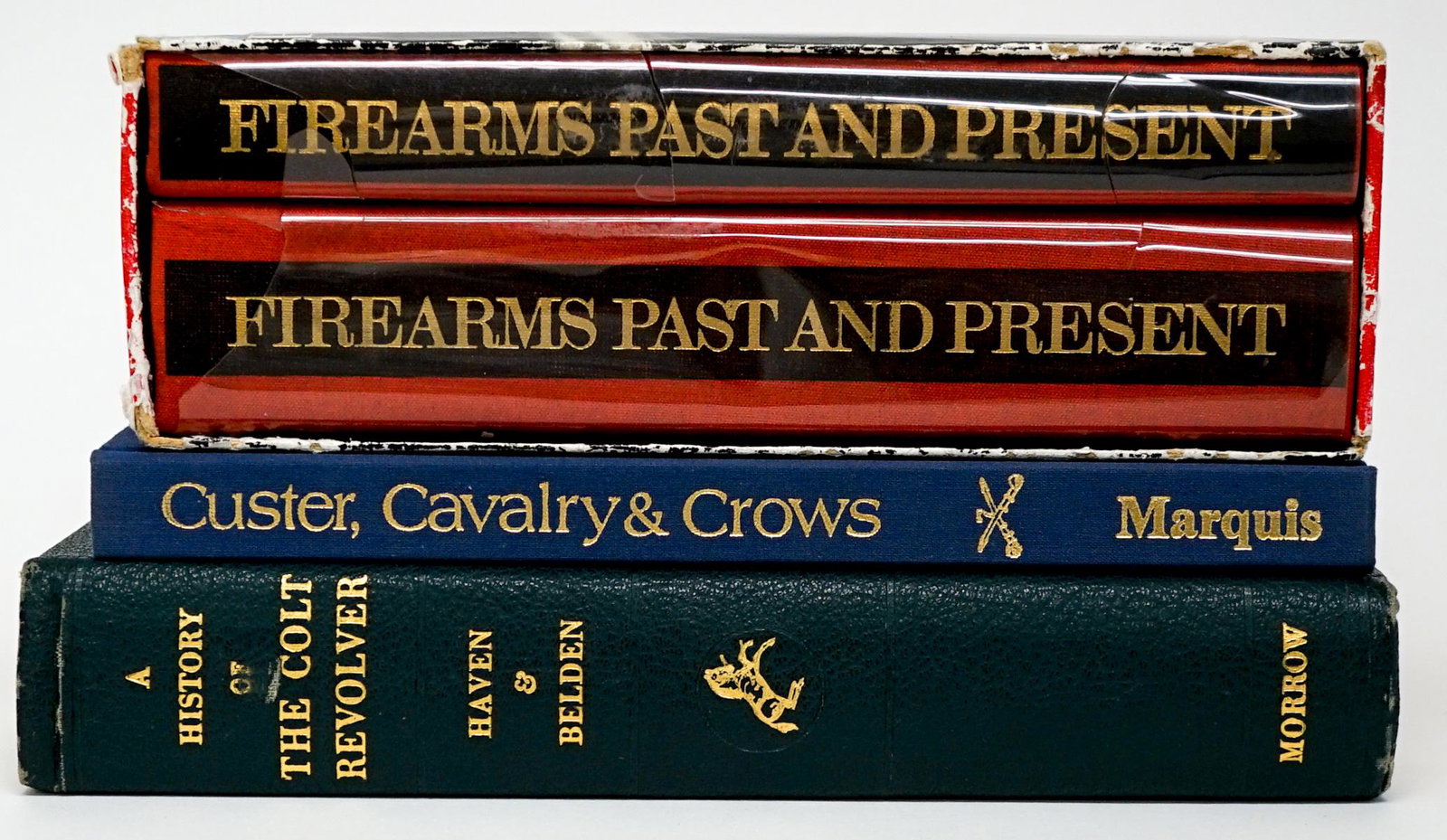 Firearms (4) Books: Group of four books of firearms. Includes: 1) Lugs Firearms Past and Present. Two volume set with slipcase. 2) Custer, Calvary and Crows. 3) History of the Colt Revolver by Haven and Belden. 1940. Gro