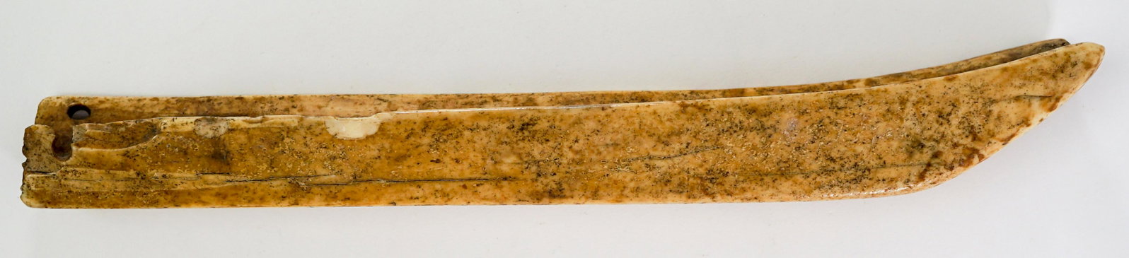Inuit Eskimo Bone Friction Fire Starter: Inuit Eskimo bone friction fire starter. Bone tool, grooved with holes on ends. Measures 13-in. in length. If lot is absent of a condition report a condition report may be requested via email. Buyer m