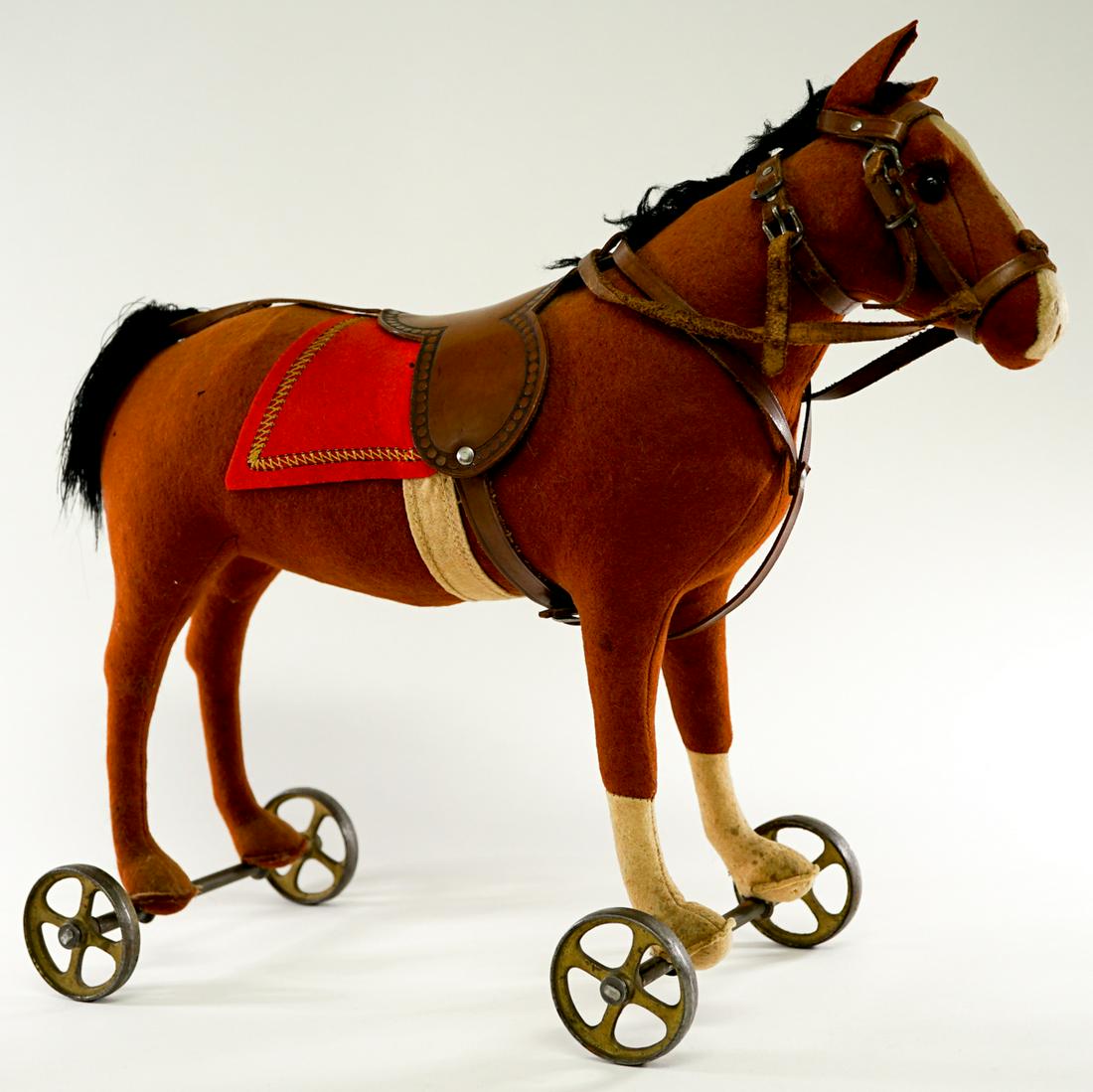Antique Steiff Horse Pull Toy: Antique Steiff horse pull toy. Measures 14-in. x 16.5-in. Very good condition. If lot is absent of a condition report a condition report may be requested via email. Buyer must view photographs or scan
