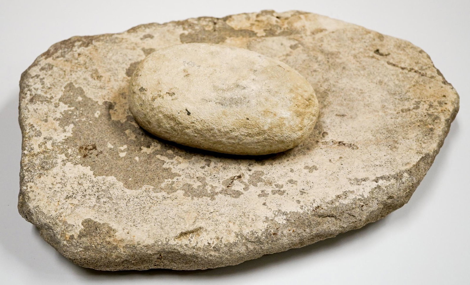 Native American Stone Mortar and Pestle: Native American stone mortar and pestle. Mortar measures 15-in. x 10-in. Provenance: Vernon Siepert collection. We are proud to offer this rare and important artifact collection. All artifacts gathere