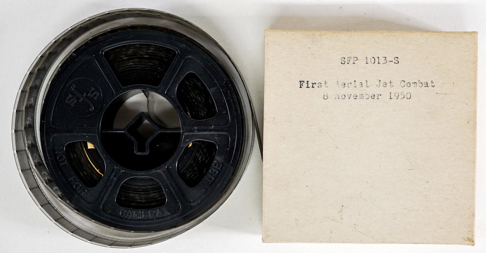 First Aerial Jet Combat 16mm Film: Air Force Film Library Center 16mm film 'First Aerial Jet Combat 8 November 1950'. Black and white film filling almost all of the 3-inch diameter plastic reel. Does not give the running time. Not view