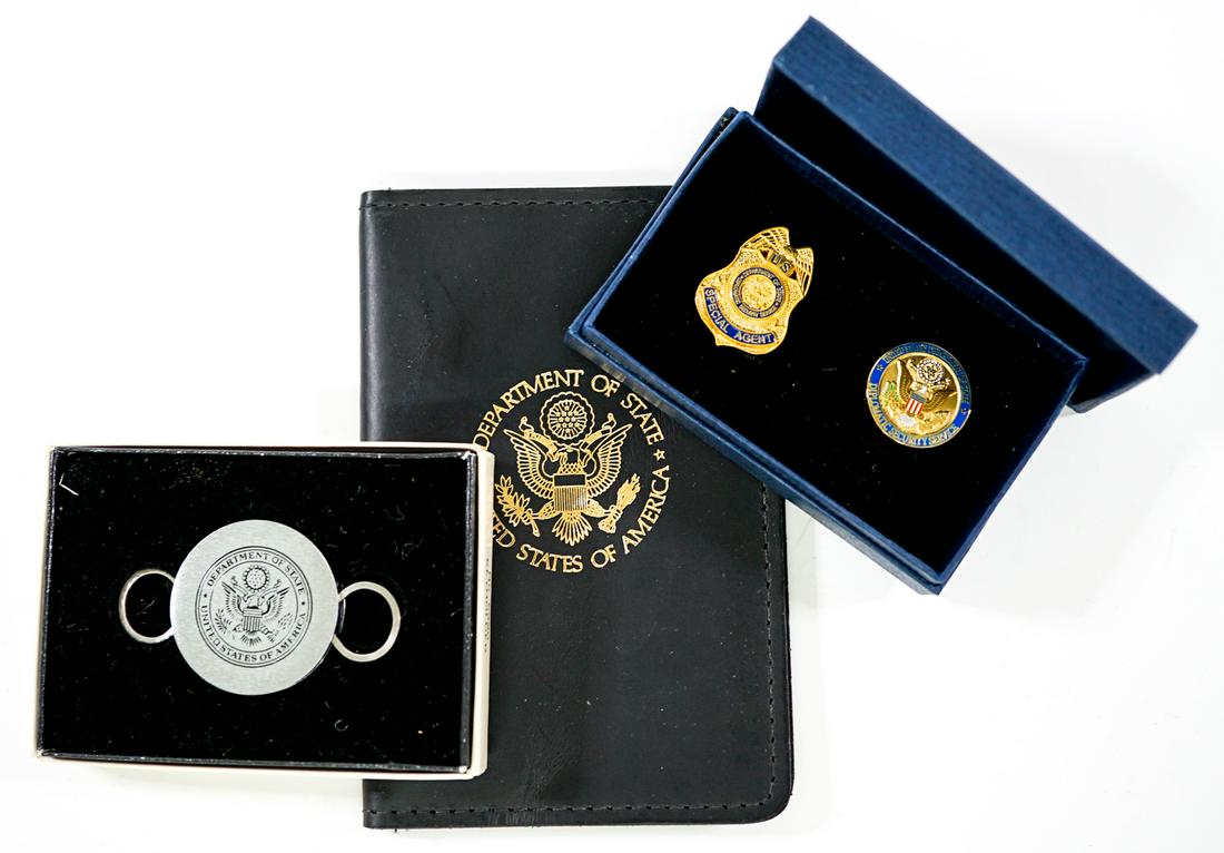 Department of State Key Holder; Pins; ID Holder: United States Government Department of State vintage key holder; badge ID holder and set of pins 'Special Agent' and Diplomatic Security Service'. Provenance: Estate of former United States of America