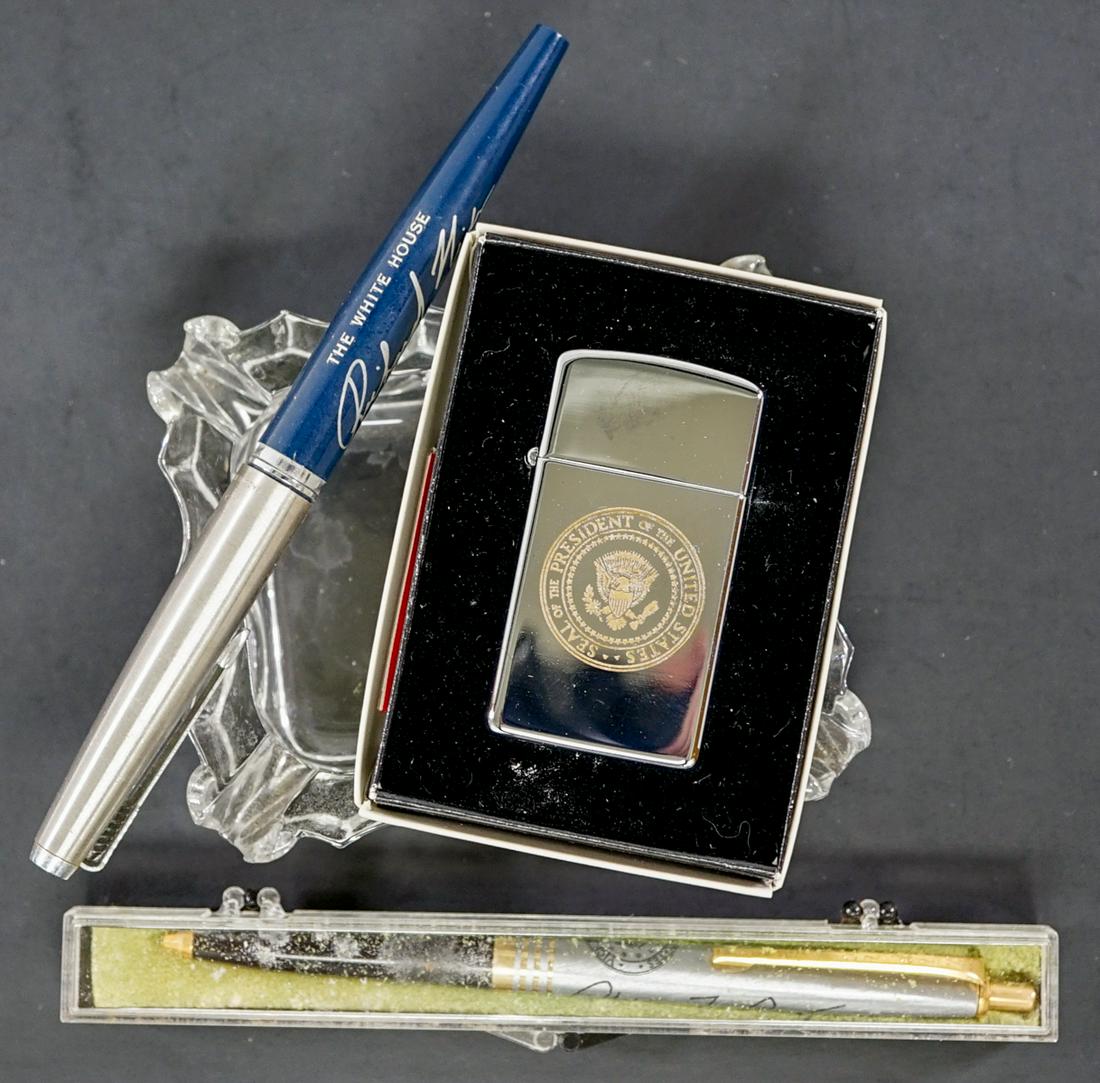 Vintage U. S. President Ashtray, Lighter and Pens: Presidential Seal vintage glass ashtray with one 'ZIPPO' lighter and one Richard Nixon inscribed pen and one Spiro Agnew inscribed pen. Provenance: Estate of former United States of America government