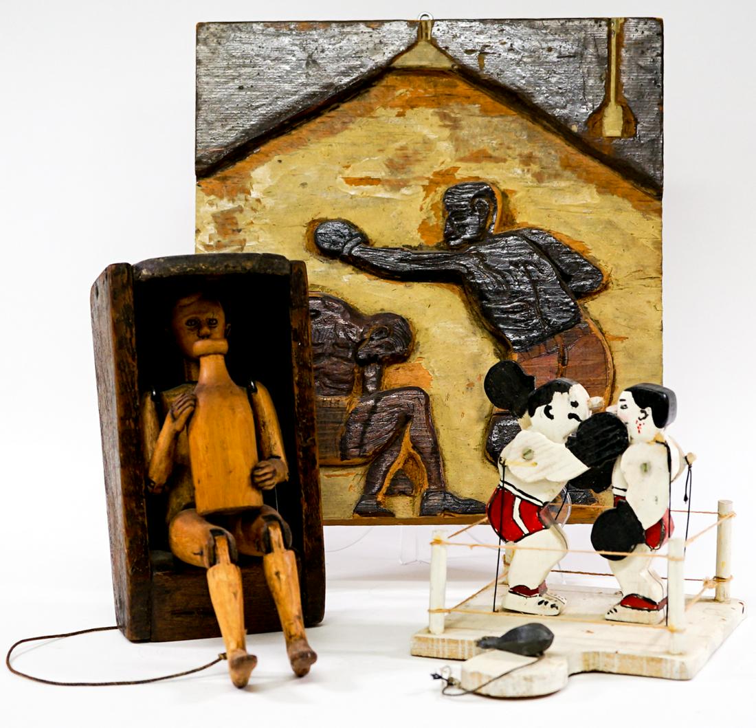 Antique Wood Art and Pull Toys (3): Antique wood art. Boxing plaque (measures 12 in. x 10.5 in.) and boxers in ring pull toy. Also, wall mountable man with jug pull toy. Provenance: Gatz Hjortsberg (American Novelist) Collection, Living