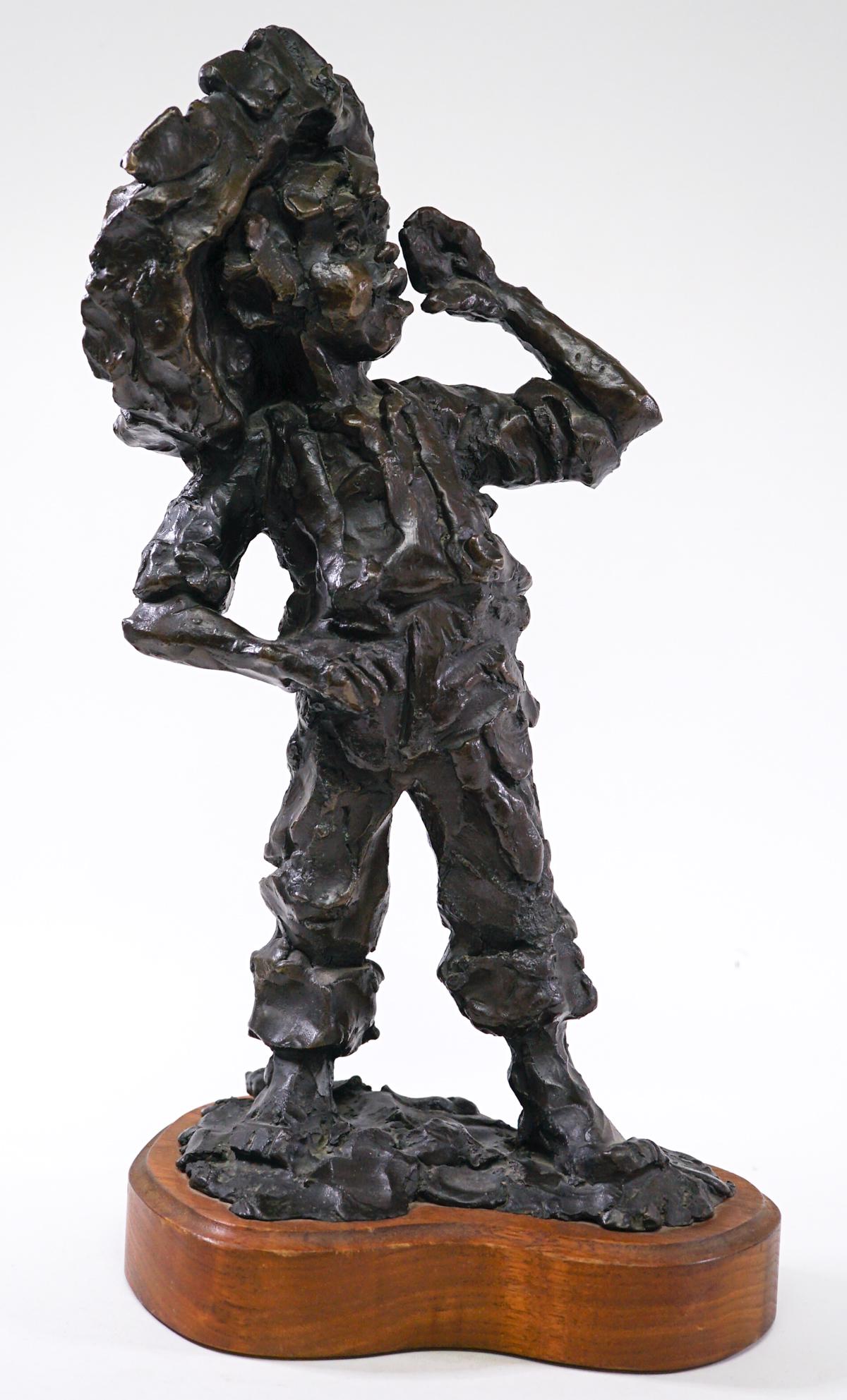 Gary Schildt Bronze Child 1982 5/10: Gary Schildt (Western Artist and Blackfeet Tribal member, b. 1938) bronze sculpture of boy calling. Signed and dated 1982. Numbered 5/10. Mounted on wood base. Measures 14.5 in x 8 in. x 5.5 in. Base