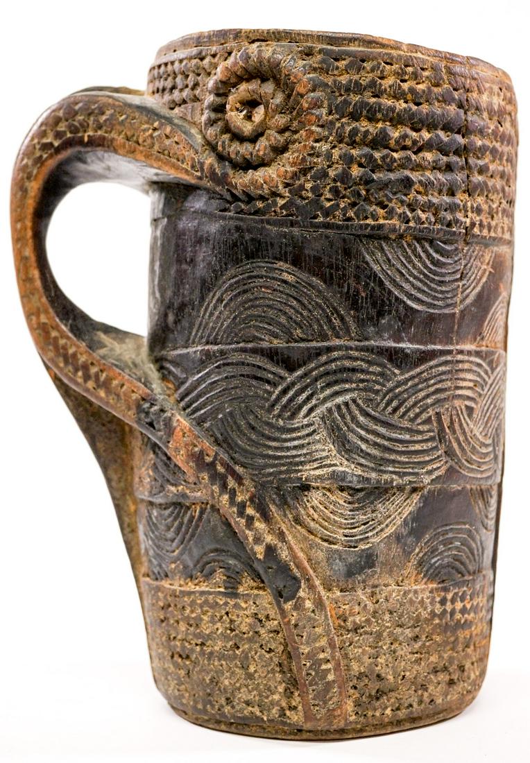 Scandinavian Antique Wood Tankard: Scandinavian Antique Carved Wood Tankard. Measures 10 in. tall and 5.5 in. across rim and 4.5 in. across base. Provenance: Gatz Hjortsberg (American Novelist) Collection, Livingston, Montana. If lot i