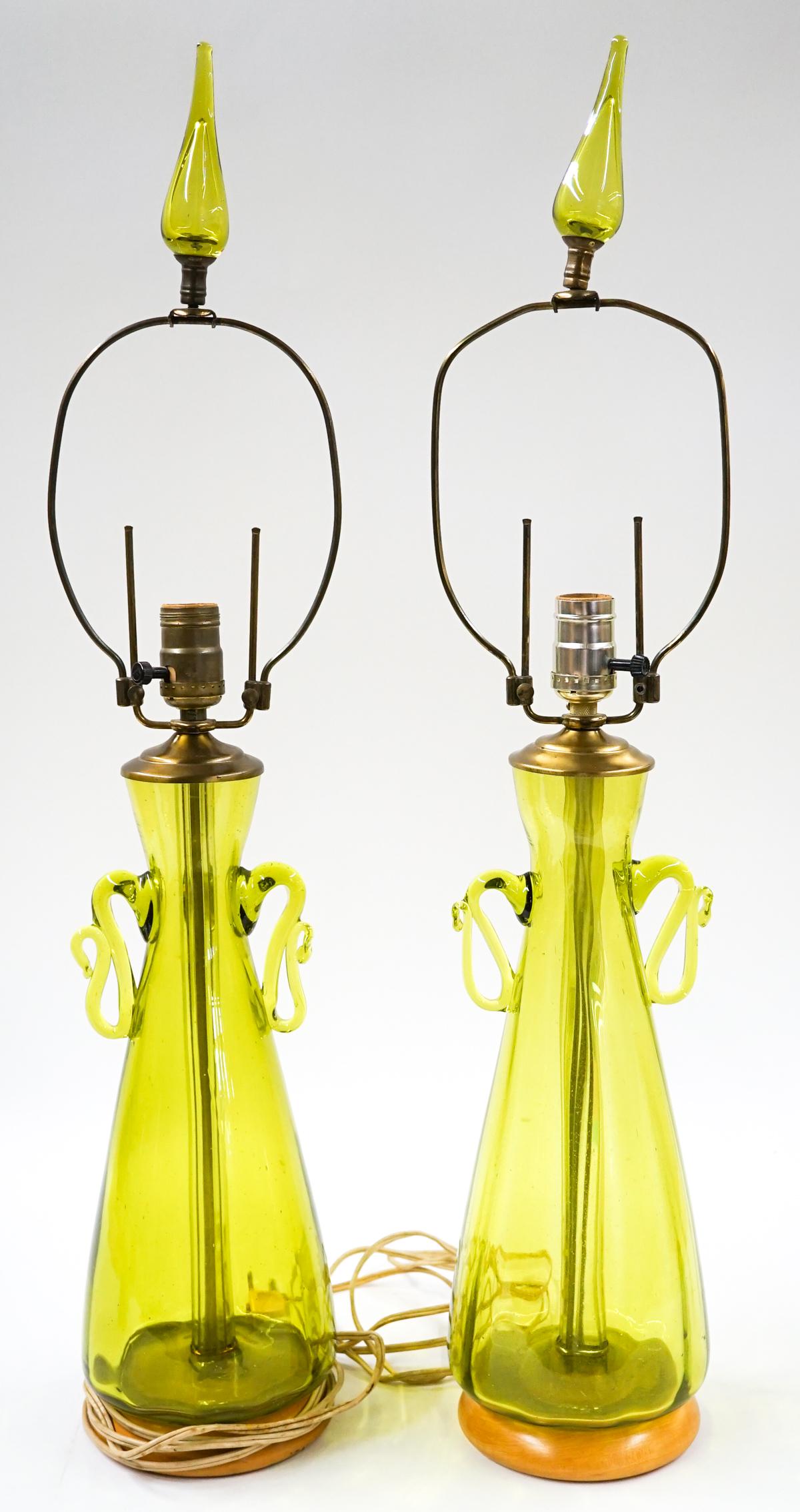[Blenko] Mid-Century Jungle Glass Lamp (2): Set of two Blenko (or other maker) mid-century jungle glass lamps on wood base. Measure 30 in. tall and 6 in. diameter at base. No chips, cracks or repairs. These have not been tested. Provenance: Tri
