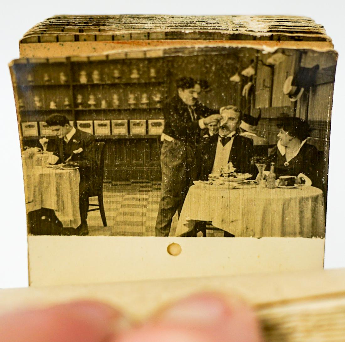 Charlie Chaplin Mutoscope Flip-Card Reel: Charlie Chaplin Mutoscope Flip-Card Movie Reel. Measures 10.5-in. x 2.875-in. Fair to good condition. Provenance: Gatz Hjortsberg collection. If lot is absent of a condition report one may be requeste