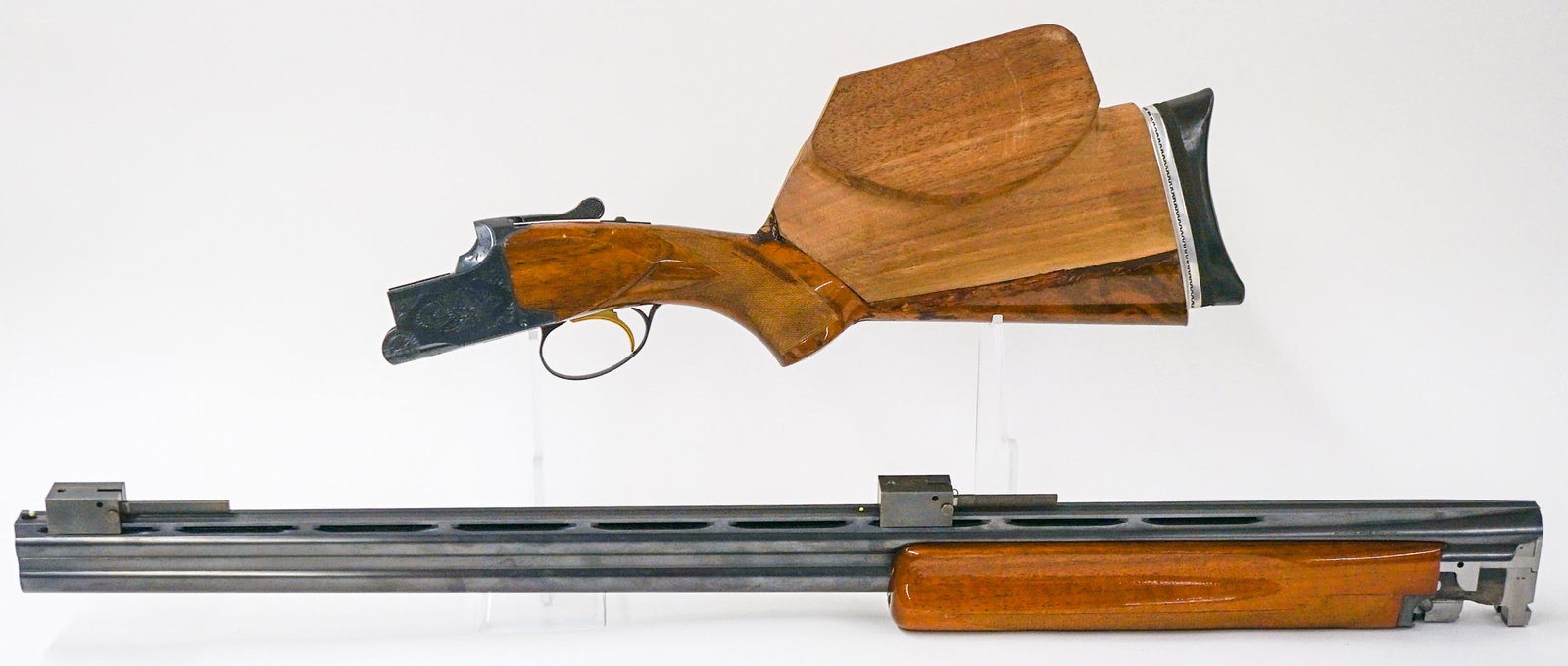 Browning Lightning 12 Gauge O/U Made in Belgium: Browning Lightning 12 Gauge over/under shotgun. Very good to excellent condition. Barrel length 32-in. Serial no. 1518 S9. Stock has been altered/embellished. A $40 transfer/processing fee plus shippi
