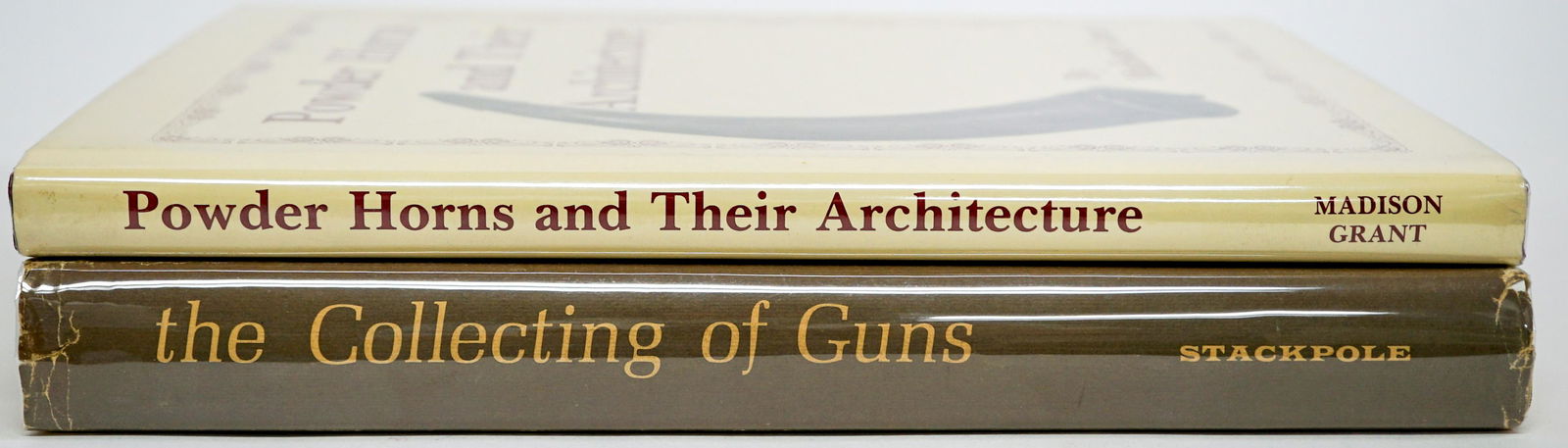 Firearms and Related (2) Books: Two books of firearms and related books. Includes: 1) Powder Horns and Their Achitecture by Madison Grant . 1987 with dust jacket unclipped. 2) The Collecting of Guns by James E. Serven. 1964 with dus