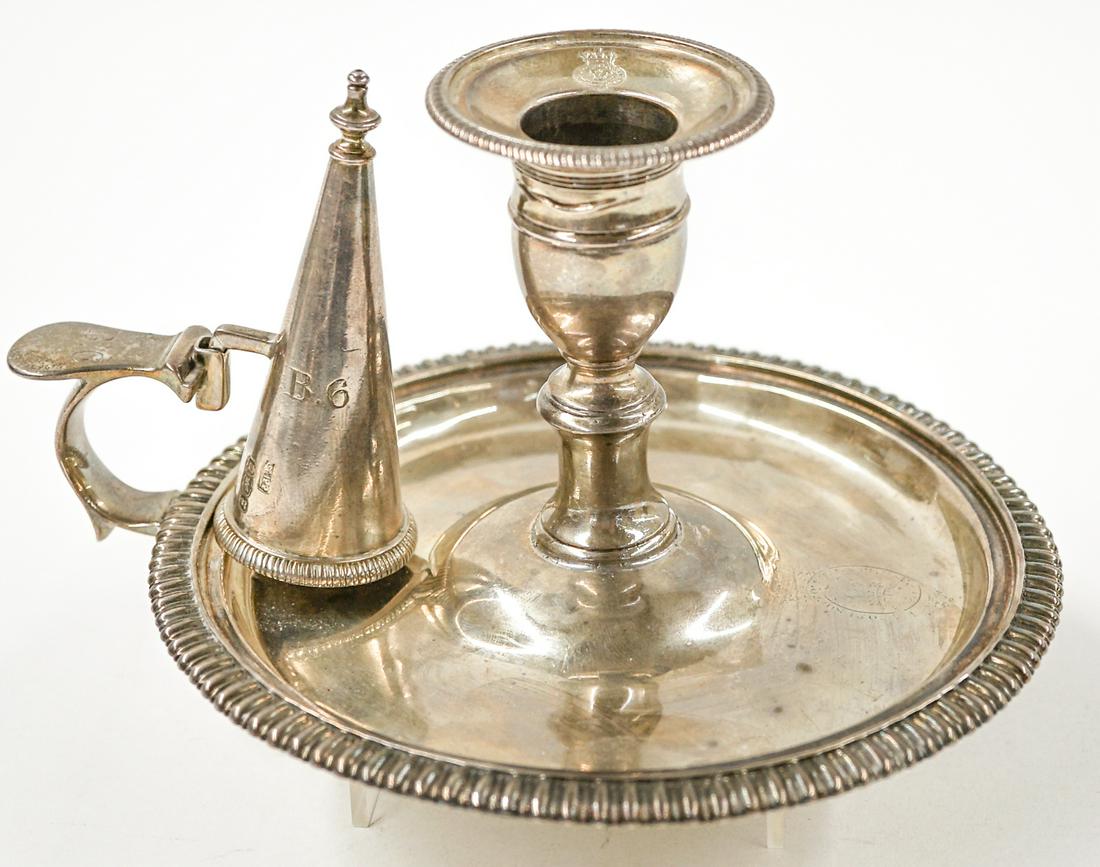 Georgian London Sterling Candle Holder: George III London sterling candle holder with W.E. hallmarks. Date mark 1817. Measures 6.75-in. x 3.25-in. Total weight is 10.5 troy ounces. Includes a non-matching, slightly later English sterling sn