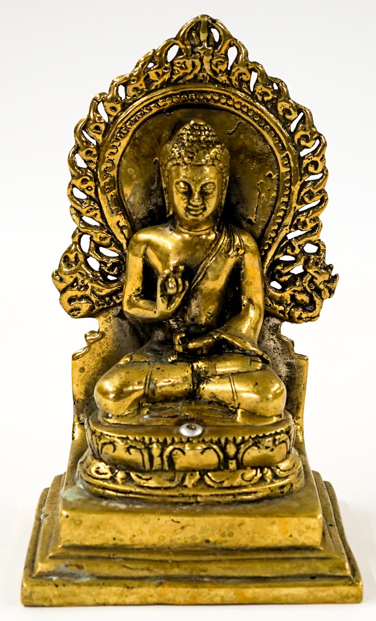 Antique Brass Deity Figure: Antique brass deity figure. Measures 7.25-in. x 4.375-in. x 3.125-in. If lot is absent of a condition report one may be requested via email. Condition report is provided as an opinion only and is no g