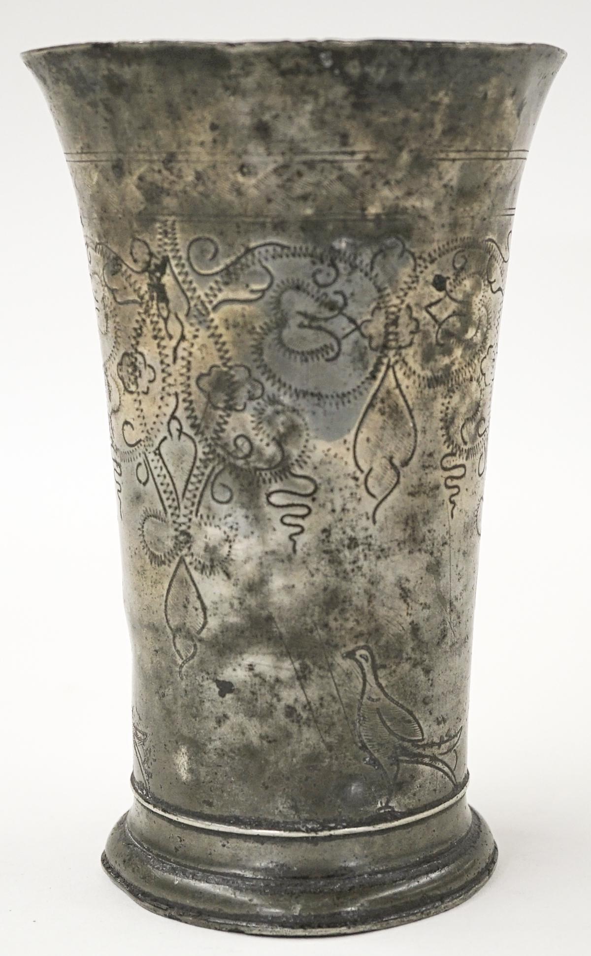 Antique Dutch Pewter Beaker Circa 1700: Antique Dutch Pewter Beaker With Wriggle Work Floral Decoration, Circa 1700. Measures 7-in. x 4.25-in. If lot is absent of a condition report one may be requested via email. Condition report is provid