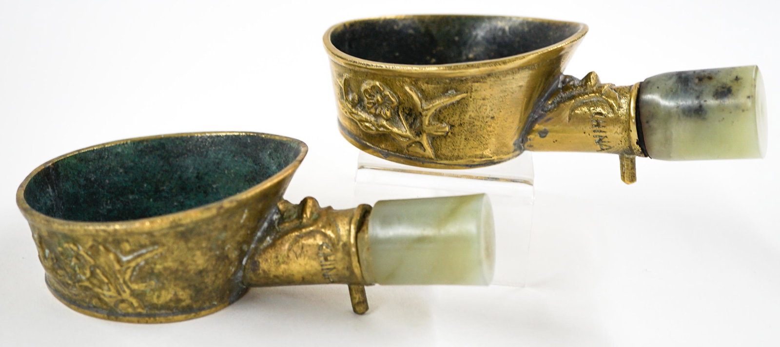 Chinese Jade Handle Silk Irons (2): A pair of old Chinese jade handle silk irons. They measure 5-in. x 3-in. If lot is absent of a condition report one may be requested via email. Condition report is provided as an opinion only and is n