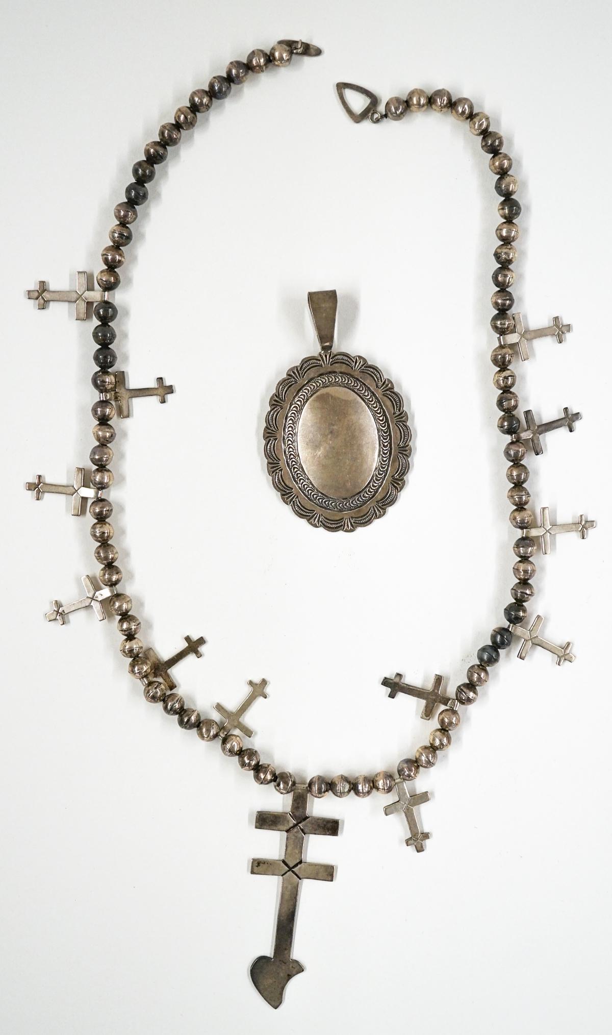 Moses Jack Necklace, A. Blackgoat Pendant: A Moses Jack stamped silver necklace measuring 25-inches in length with center pendant measuring 3.25-in. x 1.125-in. and a A. Blackgoat sterling silver pendant measuring 3.25-in. x 2-in. Excellent co