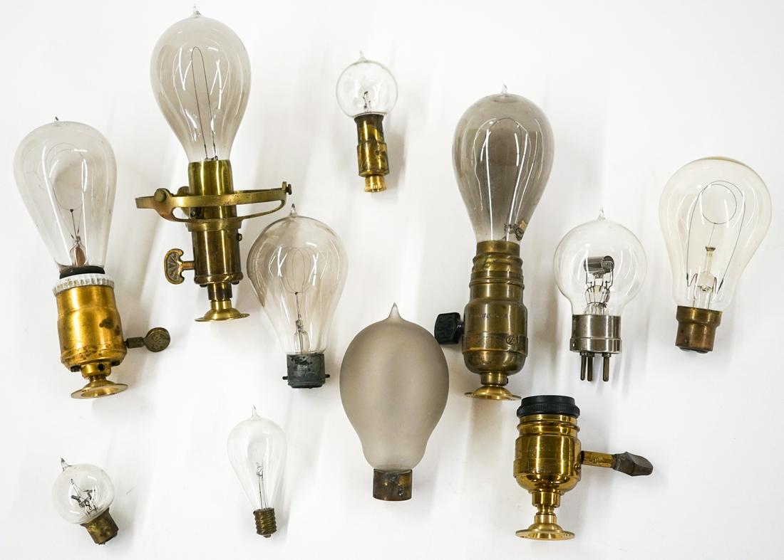 Vintage Light Bulbs and Parts (11): Collection of eleven vintage light bulbs and fixture parts. Various sizes. If lot is absent of a condition report one may be requested via email. Condition report is provided as an opinion only and is