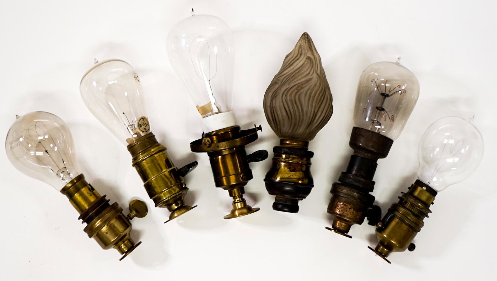 Vintage Light Bulbs and Parts (6): Collection of seven vintage light bulbs and fixture parts. Various sizes. If lot is absent of a condition report one may be requested via email. Condition report is provided as an opinion only and is 