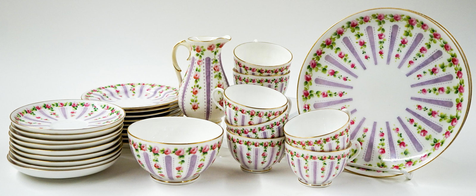 Royal Worcester England (28 Pieces) China: Twenty-eight pieces of Royal Worcester England China. All the same pattern. Includes: 2 Dinner Plates; 9 Cup Saucers; 9 Bread and Butter Plates; 1 Fruit Bowl; 7 Cups (one with crack repair) and 1 Crea