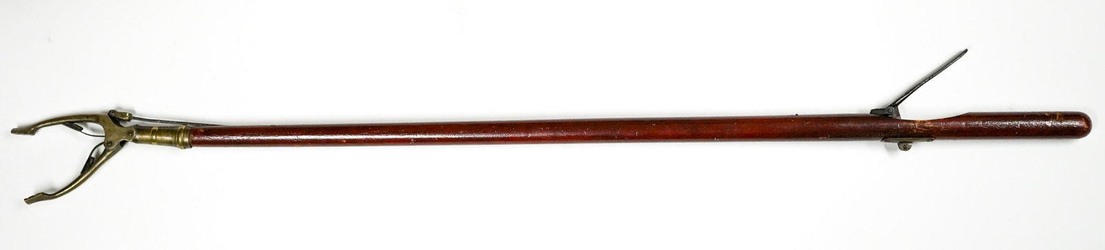 General Store Stick Grabber: Country or General store lever action stick grabber. Measures 35.5 inches and works great. If lot is absent of a condition report one may be requested via email. Condition report is provided as an opi