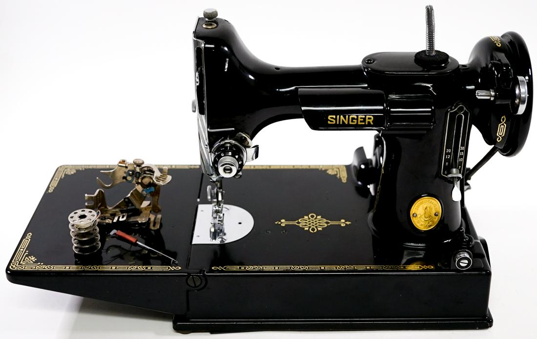 Singer Featherweight Sewing Machine: Singer Featherweight sewing machine. Excellent condition, lacking the power cord. With case. Serial #AJ192334. Weighs 18lbs, outside case measures 12x14.255x8.25". Outside shipper or buyer pick-up req