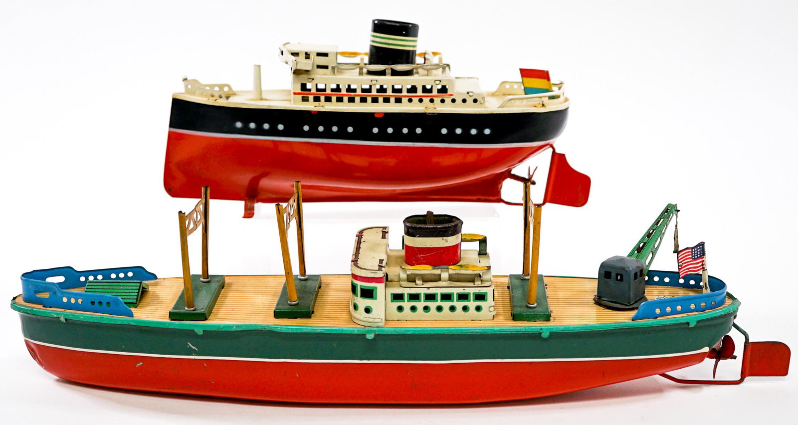 Arnold and Modern Toys (2) Ships: Two toy ships. Includes Arnold wind-up tested and not working; and Modern Toys Japan tested and not working. Do not come with keys. Measure 8.5 in. - 13.5 in. long. If lot is absent of a condition rep
