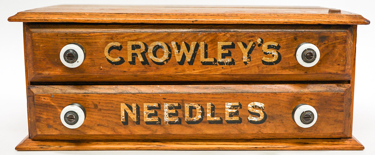 Vintage Crowley's Sewing Needle Chest: Vintage Crowley's sewing needle table chest. 2 drawer. No needles. Measures 13.25 in. x 8.25 in. x 5 in. tall. If lot is absent of a condition report one may be requested via email. Condition report i