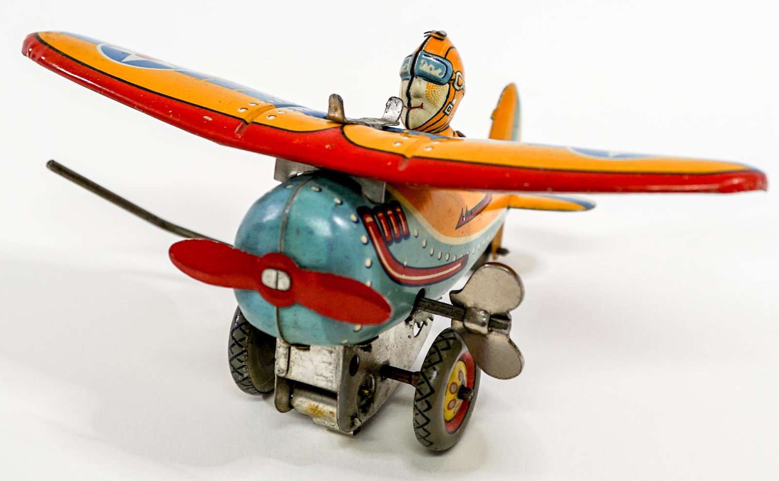 Tin Litho Airplane {Early Japan Model]: Tin litho airplane. Early Japan model. Tested, flips and rolls. Measures 6 in. across wings, 4.25 in. long and 2.75 in. tall. If lot is absent of a condition report one may be requested via email. Con