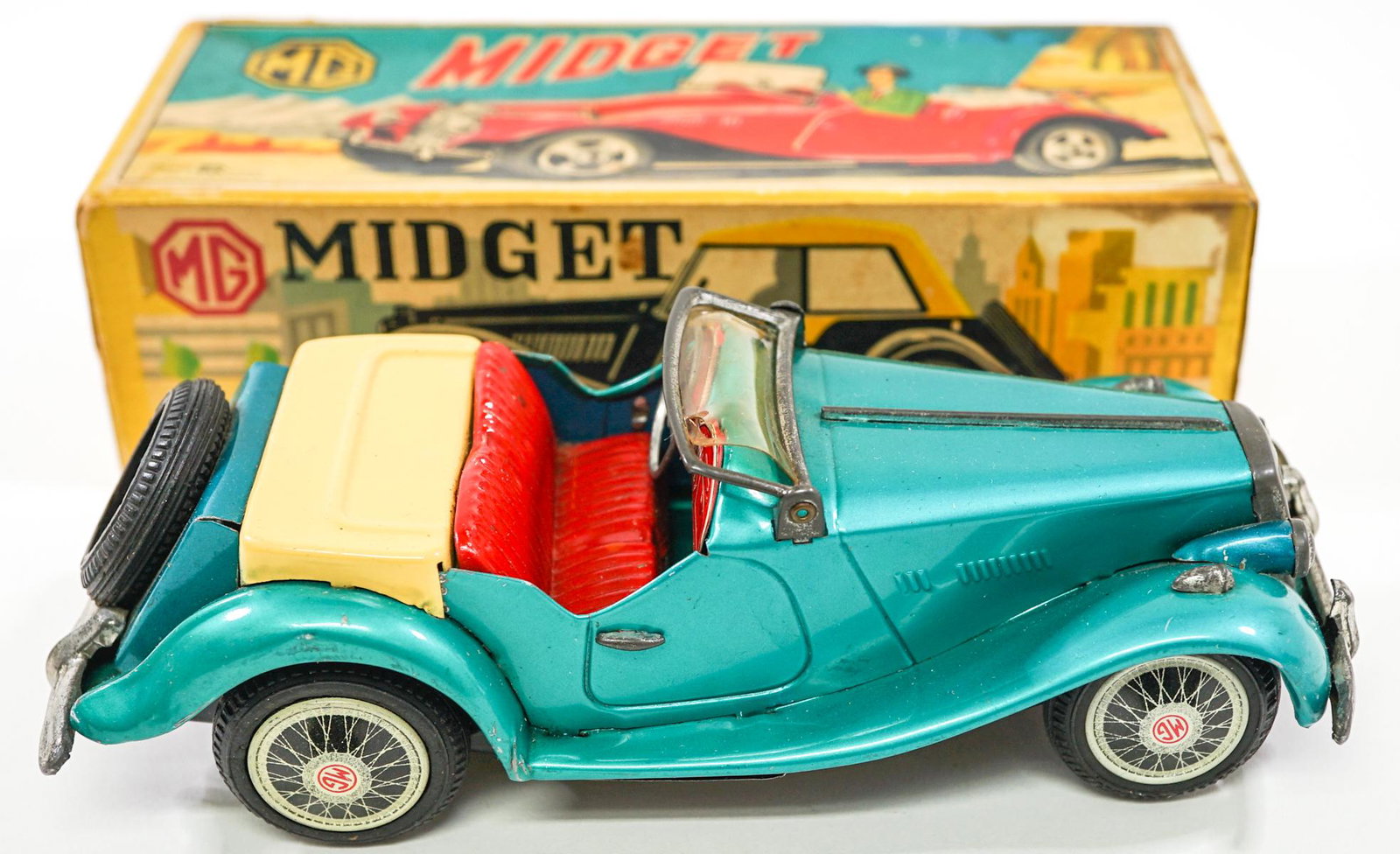 MG Midget Toy Car and Original Box: MG Midget toy car with original box. Made in Japan. Box measures 8.675 in. x 3.75 in. wide. If lot is absent of a condition report one may be requested via email. Condition report is provided as an op