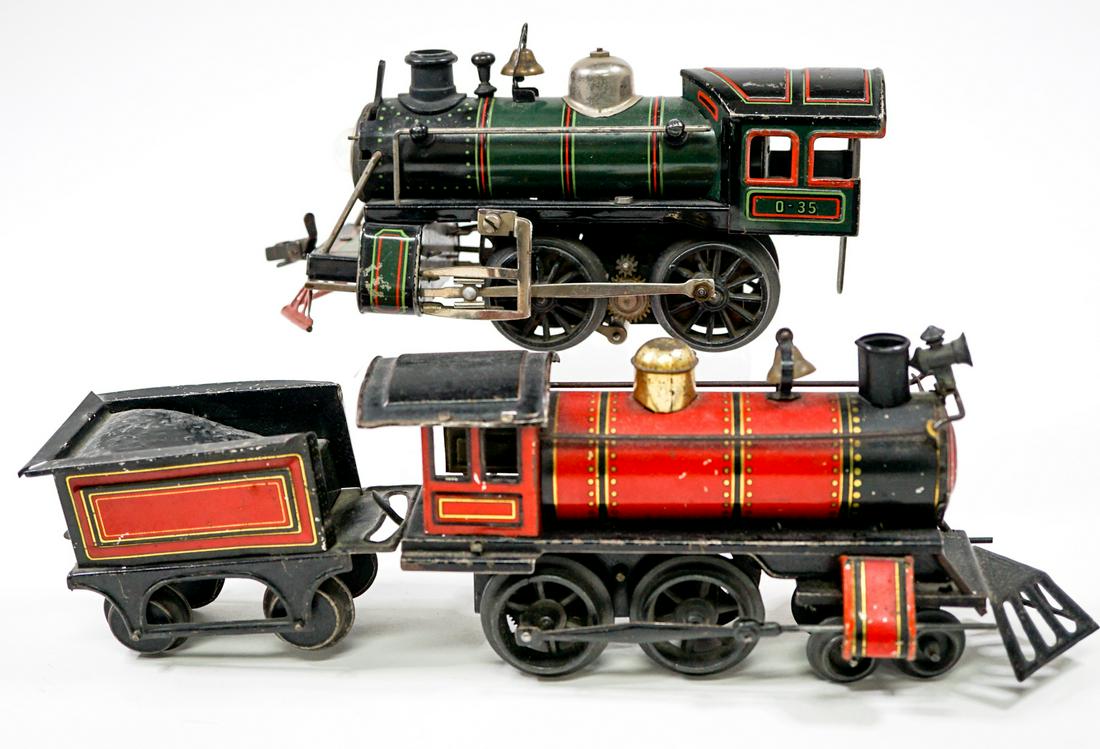Antique Toy Trains (2) AS-IS: Two antique toy trains. Untested. Estate Sale AS-IS. Engines measure 7.25 in long and one car measures 3.5 in. long and attaches to matching engine. If lot is absent of a condition report one may be r